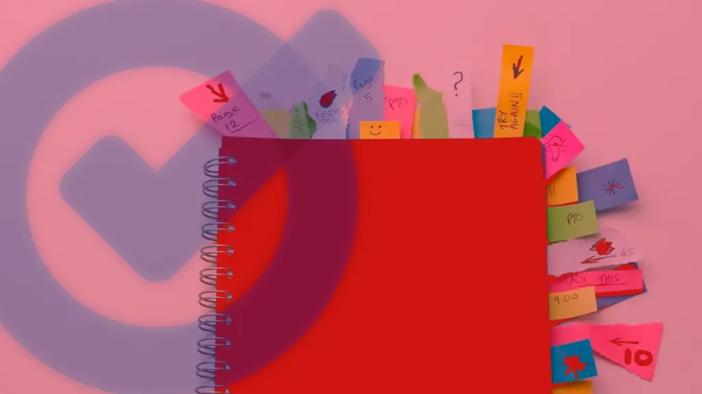 A red spiral-bound notebook stuffed with sticky markers, on a pinkish background featuring a Google Tasks logo